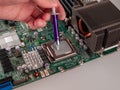 Correct application of thermal conductive paste to the cover of a computer or server circuit before installing the radiator of the