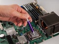 Correct application of thermal conductive paste to the cover of a computer or server circuit before installing the radiator of the