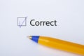 Correct - checkbox with a tick on white paper with yellow pen. Checklist concept