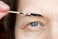 Correction of eyebrows and modelling at home, eyebrow coloring henna tattooing, permanent makeup Royalty Free Stock Photo