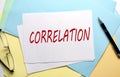 CORRELATION text on paper on colorful paper background