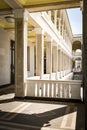 Corridor with arches and columns in old classic building. colonnaded terrace in white color Royalty Free Stock Photo