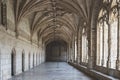 Corridor of the cloister in the Jeronimos Monastery with arched stone interior in Lisbon, Portugal