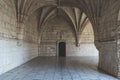 Corridor of the cloister in the Jeronimos Monastery with arched stone interior in Lisbon, Portugal