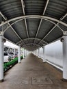 Corridor with curved roof by structure steel and with concrete poles for service area customer