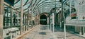 Corridor with a glass geometric roof at the station.