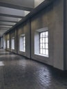 Corridor illuminated by bright windows. Modern space in old factory