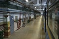 Corridor of the maintenance hall, subway train parked on pit for technical inspection