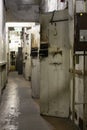 Corridor with metal cell doors in The Corner House in Riga, Latvia Royalty Free Stock Photo