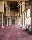 Corridor at mosque of Sultan Moaayad, ending with colorful marble wall and wooden door, Cairo, Egypt