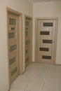 Corridor in an office building, there are entrance doors to the rooms Royalty Free Stock Photo