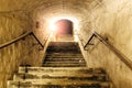 Corridor of old abandoned underground Soviet military bunker. Staircase goes up to surface