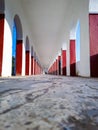 Corridor pillars low angle symmetry shot at morning from unique perspective