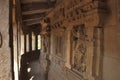 Corridor with pillars Parikrama , Durga temple, Aihole, Bagalkot, Karnataka. The Galaganatha Group of temples. Figure of Vishnu is