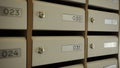 Corridor with postboxes on walls in new residential building. Stock footage. View inside of the entrance of an apartment