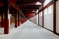 Corridor with red pillar in the tourist building park, China