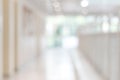 Corridor in school or office building blur background with blurry interior view empty hall way, glass curtain wall and floor