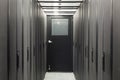 Corridor sealed with telecom racks Royalty Free Stock Photo