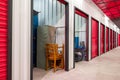 Corridor of self storage unit with red doors. Rental Storage Units Royalty Free Stock Photo