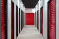 Corridor of self storage unit with red doors. Rental Storage Units Royalty Free Stock Photo