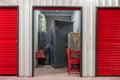 Corridor of self storage unit with red doors. Rental Storage Units Royalty Free Stock Photo