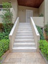 Corridor and stairs to the modern house entrance white door Royalty Free Stock Photo