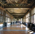 Corridor in the Uffizi Gallery, with statues and tourists Royalty Free Stock Photo