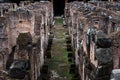 Corridor in the underground galleries of the central arena of the Colosseum in Rome Royalty Free Stock Photo