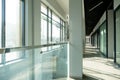 A corridor in an urban-type office building. Modern interior of the lobby of an office building with glass doors, walls and large Royalty Free Stock Photo
