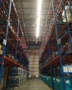 A corridor in a warehouse shelving system space in an industrial area in Indonesia