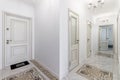 Corridor in with white walls and doors in the apartment Royalty Free Stock Photo