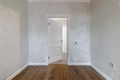 Corridor with white walls and doors in an apartment with a marble floor Royalty Free Stock Photo