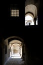 Corridors leading from dark to light in the old building Royalty Free Stock Photo