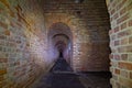 Corridors of the old fortification structure of red brick Royalty Free Stock Photo