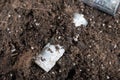 A corroded battery is lying on the ground. Environmental protection and waste recycling. Close-up shot