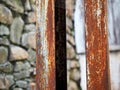 Corroded steel pillars as a background. Rusted white painted metal surface.