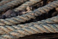 Corroded Twisted ship mooring strong rope for securing fishing boats Royalty Free Stock Photo