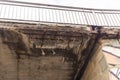 Corrosion of the concrete structure of the bridge due to the precipitation and chemical reagents. Royalty Free Stock Photo