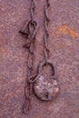 Corrosion of metal objects. Sheet, padlock and chain Royalty Free Stock Photo