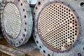 Corrosion, refinery heat exchanger chiller tubes with flange system. Two Industrial heat exchangers or boiler rusty tube Royalty Free Stock Photo