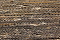 Corrugated cardboard background. Stack of old paper sheets