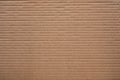 Corrugated cardboard for packing. abstract background horizontal lines  with wavy lines of beige color Royalty Free Stock Photo