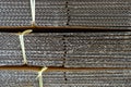 Corrugated cardboard stacked with yellow plastic rope Royalty Free Stock Photo