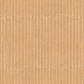 Corrugated cardboard texture. Blank empty cardboard with ridges and folded creases. Recycled material background. Seamless tiled Royalty Free Stock Photo
