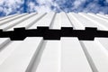 Corrugated iron roof against cloudy sky Royalty Free Stock Photo