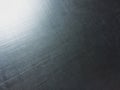 Corrugated metal alloy, metal surface, aluminum alloy, magnesium alloy, sun flare, grainy texture Royalty Free Stock Photo