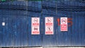 Corrugated metal fence covered with prohibition signs Royalty Free Stock Photo