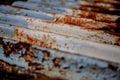 Corrugated metal with patina of brown, rust, blue, and white