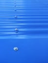 Blueish metallic corrugated sheet roof texture. Deep blue profiled sheet panel. Corrugated Metal Roof Exterior Close up Royalty Free Stock Photo