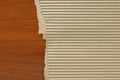 Corrugated paperboard on wood table background